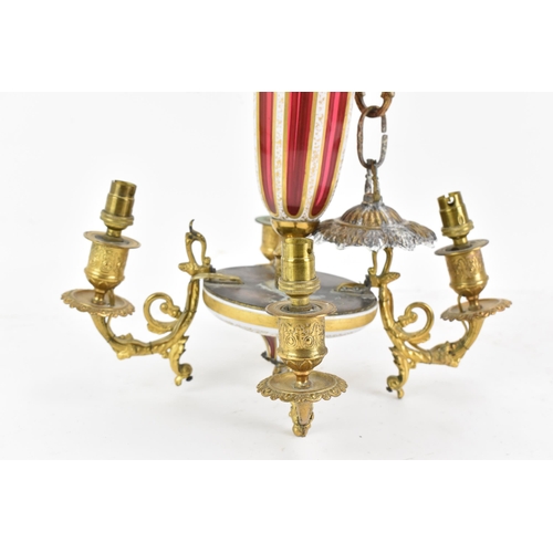 176 - A late 19th century French chandelier, having a bohemian overlaid ruby glass column and finial, with... 