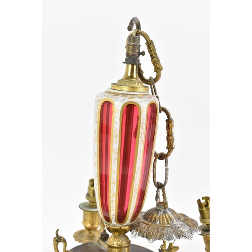 176 - A late 19th century French chandelier, having a bohemian overlaid ruby glass column and finial, with... 