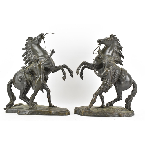 177 - A pair of late 19th/early 20th century French patinated bronze models of the Marly Horses, after Gui... 