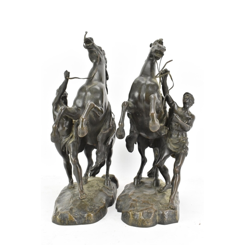 177 - A pair of late 19th/early 20th century French patinated bronze models of the Marly Horses, after Gui... 