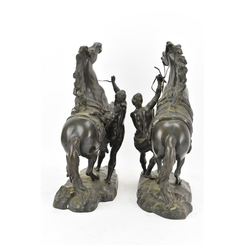 177 - A pair of late 19th/early 20th century French patinated bronze models of the Marly Horses, after Gui... 