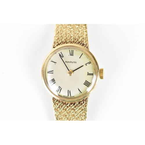 18 - A Marvin, manual wind, ladies, 9ct gold wristwatch, the silvered dial having Roman numerals, fitted ... 