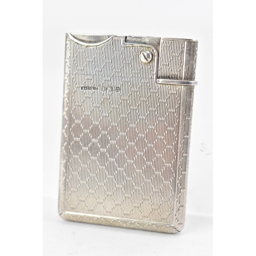 187 - A mid 20th century Asprey & Co Ltd silver lighter, of rectangular form with machine turned decoratio... 