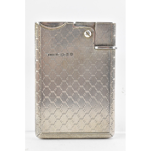 187 - A mid 20th century Asprey & Co Ltd silver lighter, of rectangular form with machine turned decoratio... 