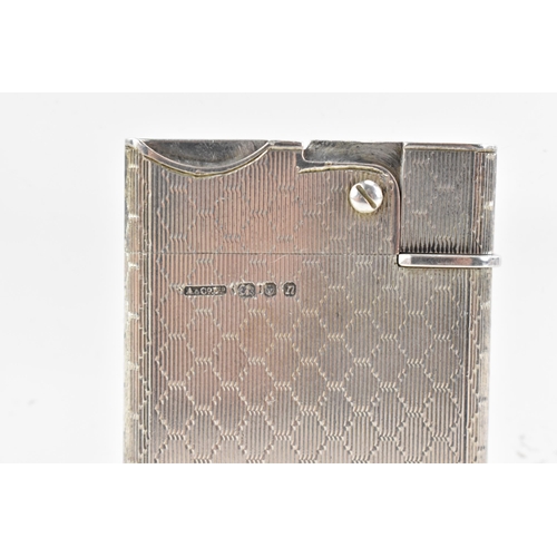 187 - A mid 20th century Asprey & Co Ltd silver lighter, of rectangular form with machine turned decoratio... 