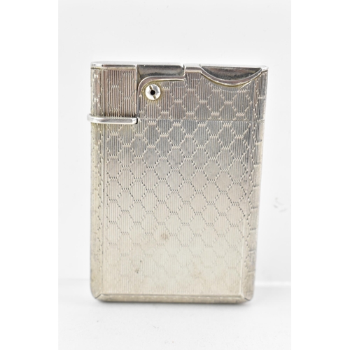 187 - A mid 20th century Asprey & Co Ltd silver lighter, of rectangular form with machine turned decoratio... 