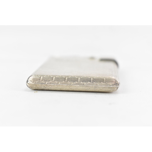 187 - A mid 20th century Asprey & Co Ltd silver lighter, of rectangular form with machine turned decoratio... 