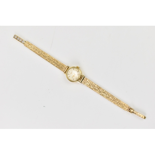 19 - A Longines, manual wind, ladies, 9ct gold wristwatch, the circular silvered dial having gilt baton m... 