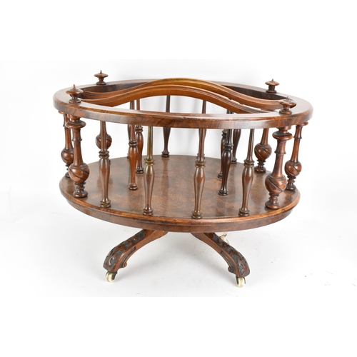 190 - A Victorian walnut Canterbury, of oval form, having turned finials, dividing sections and border sup... 