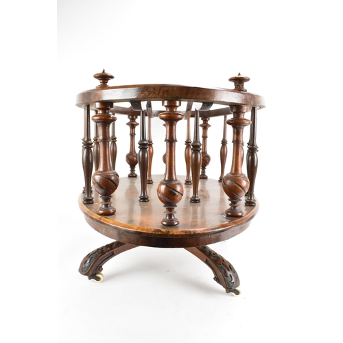 190 - A Victorian walnut Canterbury, of oval form, having turned finials, dividing sections and border sup... 