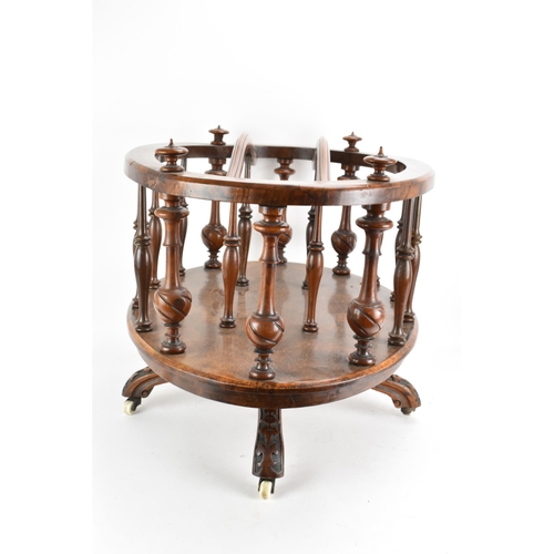 190 - A Victorian walnut Canterbury, of oval form, having turned finials, dividing sections and border sup... 