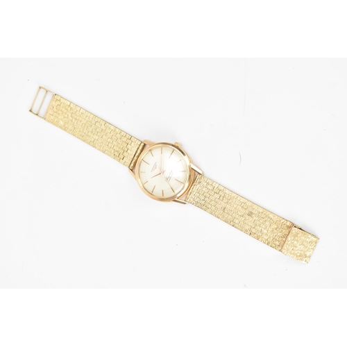 20 - A Longines Flagship, automatic, gents, 18ct gold wristwatch, circa 1961, having a silvered dial with... 