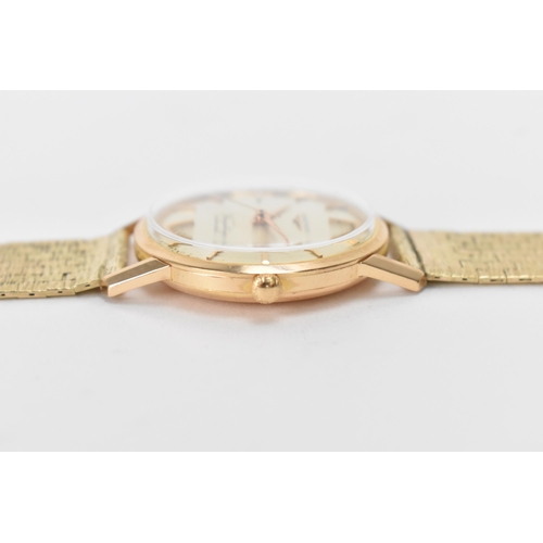 20 - A Longines Flagship, automatic, gents, 18ct gold wristwatch, circa 1961, having a silvered dial with... 