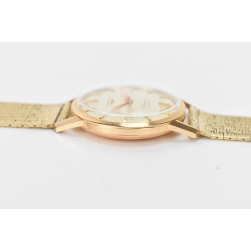 20 - A Longines Flagship, automatic, gents, 18ct gold wristwatch, circa 1961, having a silvered dial with... 