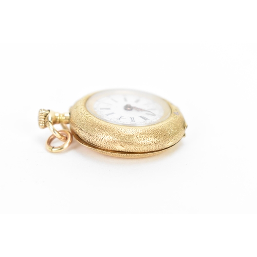 21 - An early 20th century 14ct gold, open face, key-less wound fob watch, the white enamel dial having R... 