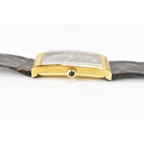 23 - A Corum, manual wind, gents, 18ct gold wristwatch, the rectangular brown dial having Roman numerals,... 