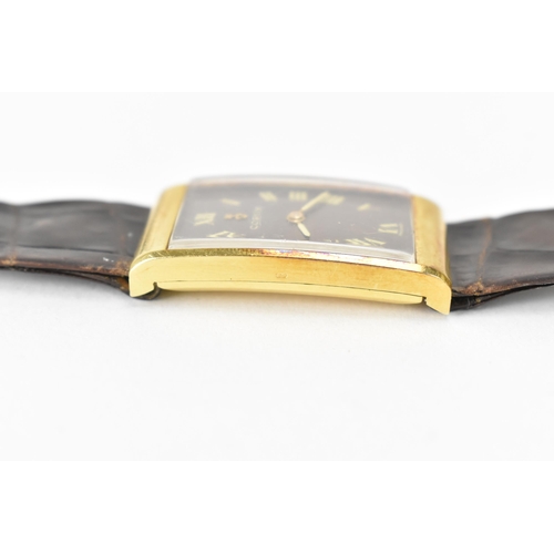 23 - A Corum, manual wind, gents, 18ct gold wristwatch, the rectangular brown dial having Roman numerals,... 