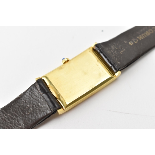 23 - A Corum, manual wind, gents, 18ct gold wristwatch, the rectangular brown dial having Roman numerals,... 