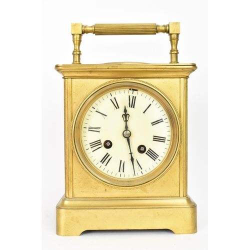 26 - An early 20th century French gilt metal large carriage clock with integrated thermometer and compass... 