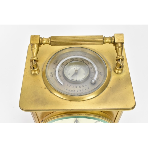 26 - An early 20th century French gilt metal large carriage clock with integrated thermometer and compass... 