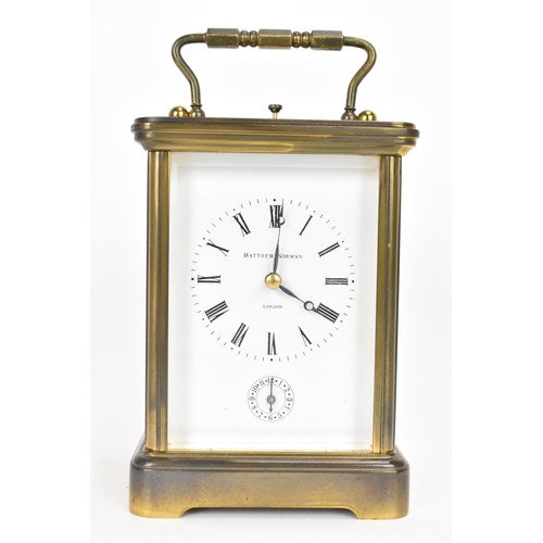 29 - A Matthew Norman gilt metal repeating and alarm carriage clock, the white enamel dial having Roman n... 