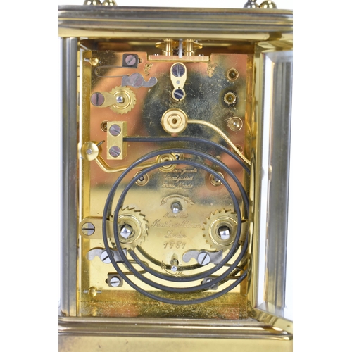 29 - A Matthew Norman gilt metal repeating and alarm carriage clock, the white enamel dial having Roman n... 