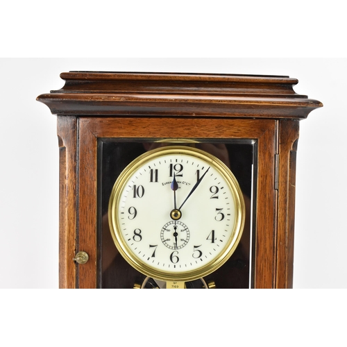 33 - An early 20th century Eureka electric mahogany cased mantle clock, the enamel dial having Arabic num... 