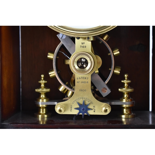 33 - An early 20th century Eureka electric mahogany cased mantle clock, the enamel dial having Arabic num... 