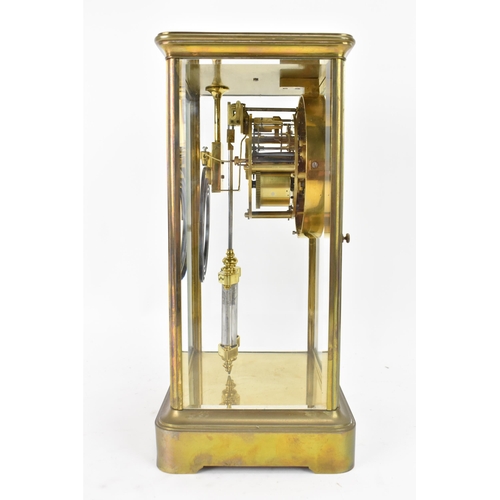 36 - A late 19th century French gilt metal and bevelled glass mantle clock, the white enamel dial having ... 