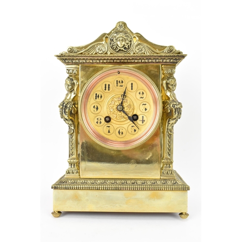 43 - A late 19th century French gilt metal mantle clock, the case of architectural form with two putti fl... 