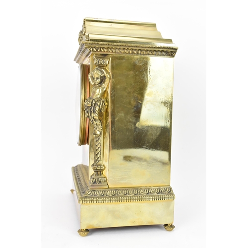 43 - A late 19th century French gilt metal mantle clock, the case of architectural form with two putti fl... 