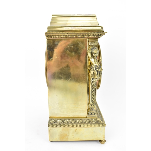 43 - A late 19th century French gilt metal mantle clock, the case of architectural form with two putti fl... 