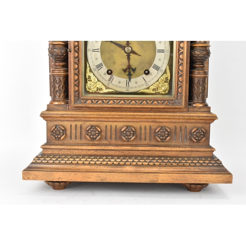 45 - A late 19th century German walnut cased 8 day mantle clock, the case of architectural form having a ... 