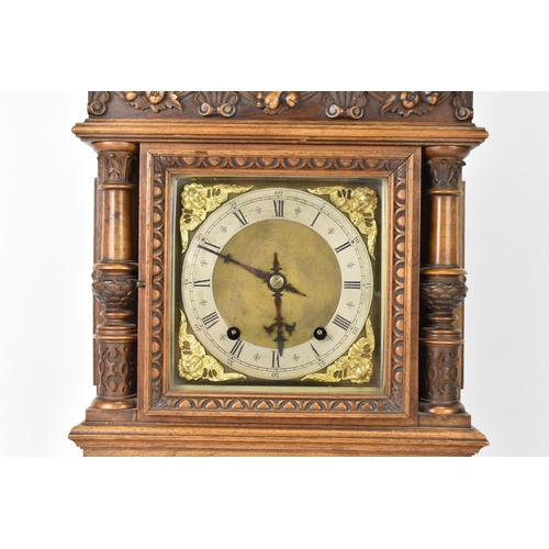 45 - A late 19th century German walnut cased 8 day mantle clock, the case of architectural form having a ... 