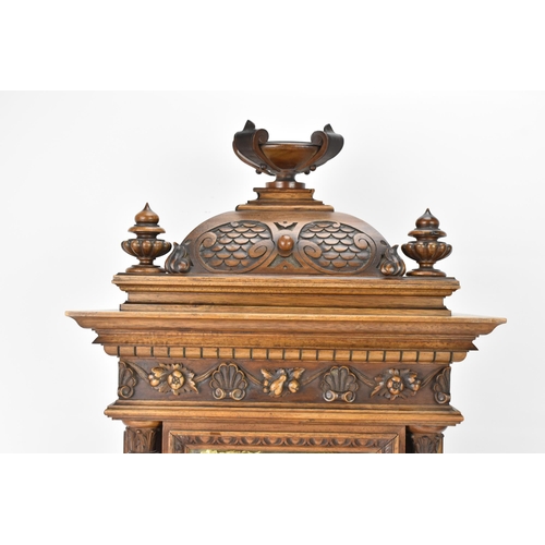 45 - A late 19th century German walnut cased 8 day mantle clock, the case of architectural form having a ... 