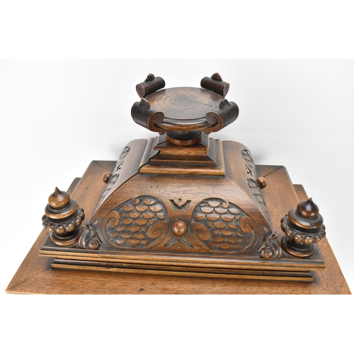 45 - A late 19th century German walnut cased 8 day mantle clock, the case of architectural form having a ... 