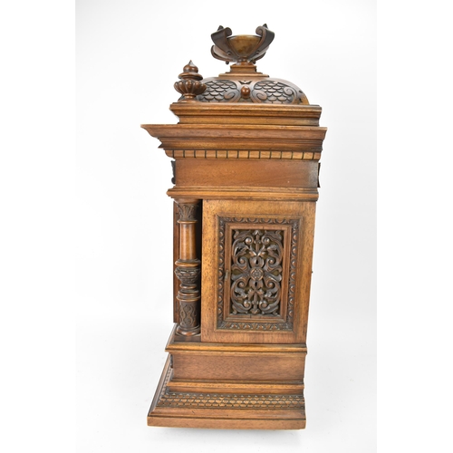 45 - A late 19th century German walnut cased 8 day mantle clock, the case of architectural form having a ... 