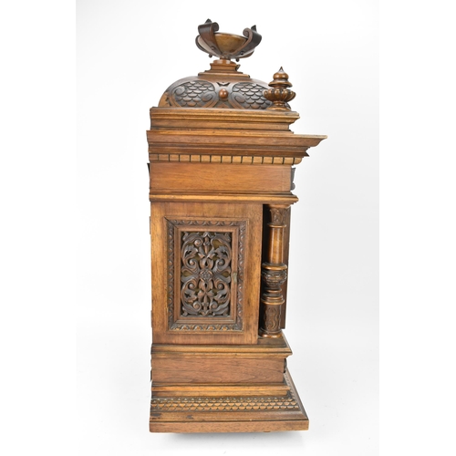 45 - A late 19th century German walnut cased 8 day mantle clock, the case of architectural form having a ... 