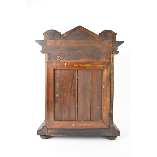 46 - A circa 1900 Junghans oak cased mantle clock, the case of architectural form with egg and dart mould... 