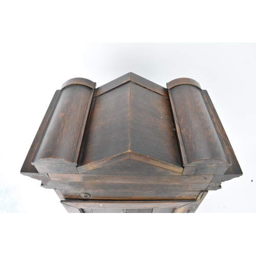 46 - A circa 1900 Junghans oak cased mantle clock, the case of architectural form with egg and dart mould... 