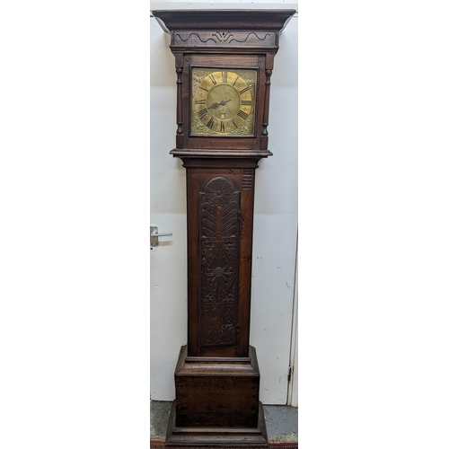 49 - An early 18th century oak cased 30 hour longcase clock, the case having a moulded cornice with a lat... 