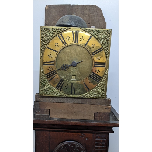 49 - An early 18th century oak cased 30 hour longcase clock, the case having a moulded cornice with a lat... 