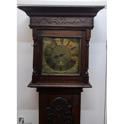 49 - An early 18th century oak cased 30 hour longcase clock, the case having a moulded cornice with a lat... 