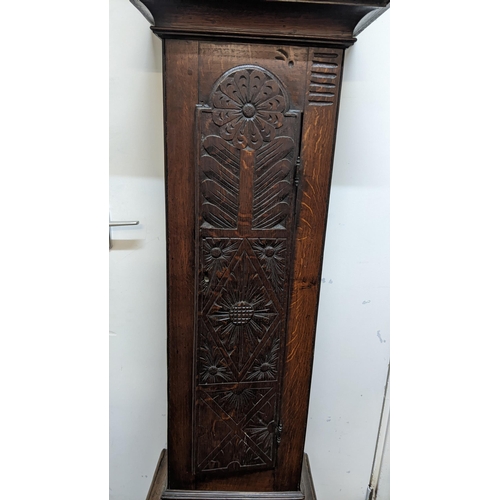 49 - An early 18th century oak cased 30 hour longcase clock, the case having a moulded cornice with a lat... 