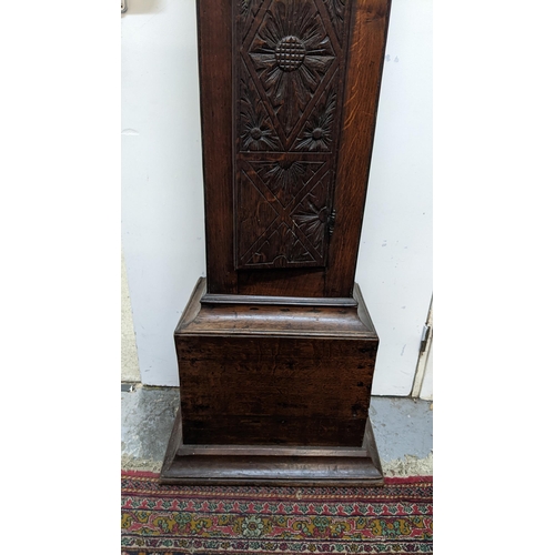 49 - An early 18th century oak cased 30 hour longcase clock, the case having a moulded cornice with a lat... 