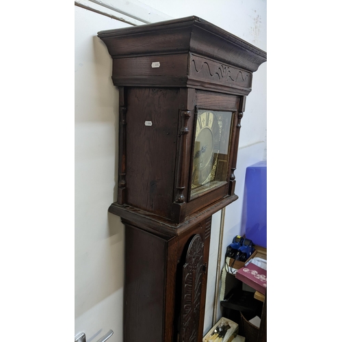 49 - An early 18th century oak cased 30 hour longcase clock, the case having a moulded cornice with a lat... 