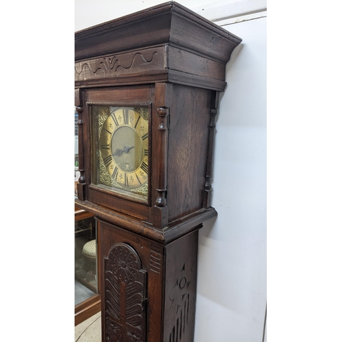 49 - An early 18th century oak cased 30 hour longcase clock, the case having a moulded cornice with a lat... 