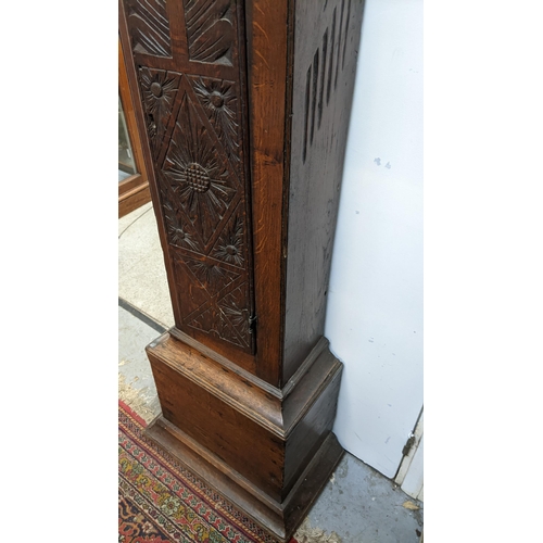 49 - An early 18th century oak cased 30 hour longcase clock, the case having a moulded cornice with a lat... 