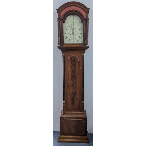 50 - An early 19th century mahogany 8 day longcase clock, having an arched top with pierced grille above ... 