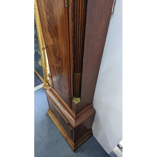 50 - An early 19th century mahogany 8 day longcase clock, having an arched top with pierced grille above ... 